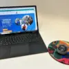 Round Mousepad designed by Yael K next to a laptop