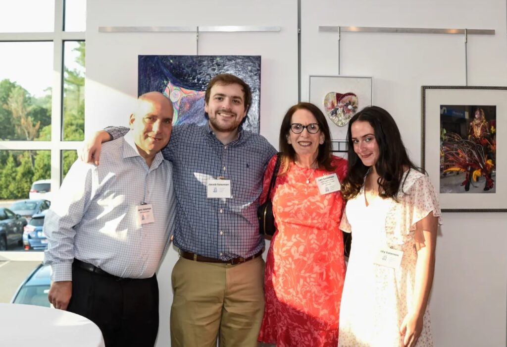 Lori, the new president smiling with her family at the JSDD Legacy Reception
